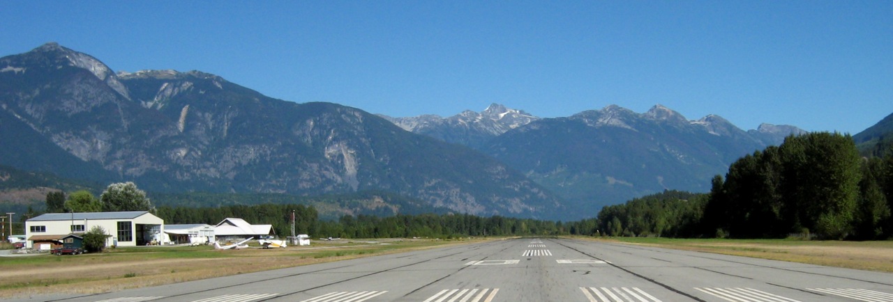 Scenic Whistler Airport view with mountain backdrop for Power Hang Gliding flights